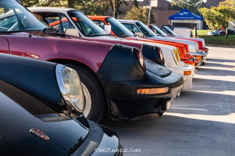 Classic car show featuring vintage sports cars and muscle cars at TheChazz.com event.